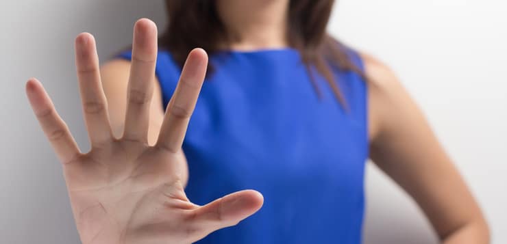 Woman Holding Up Hand Stop